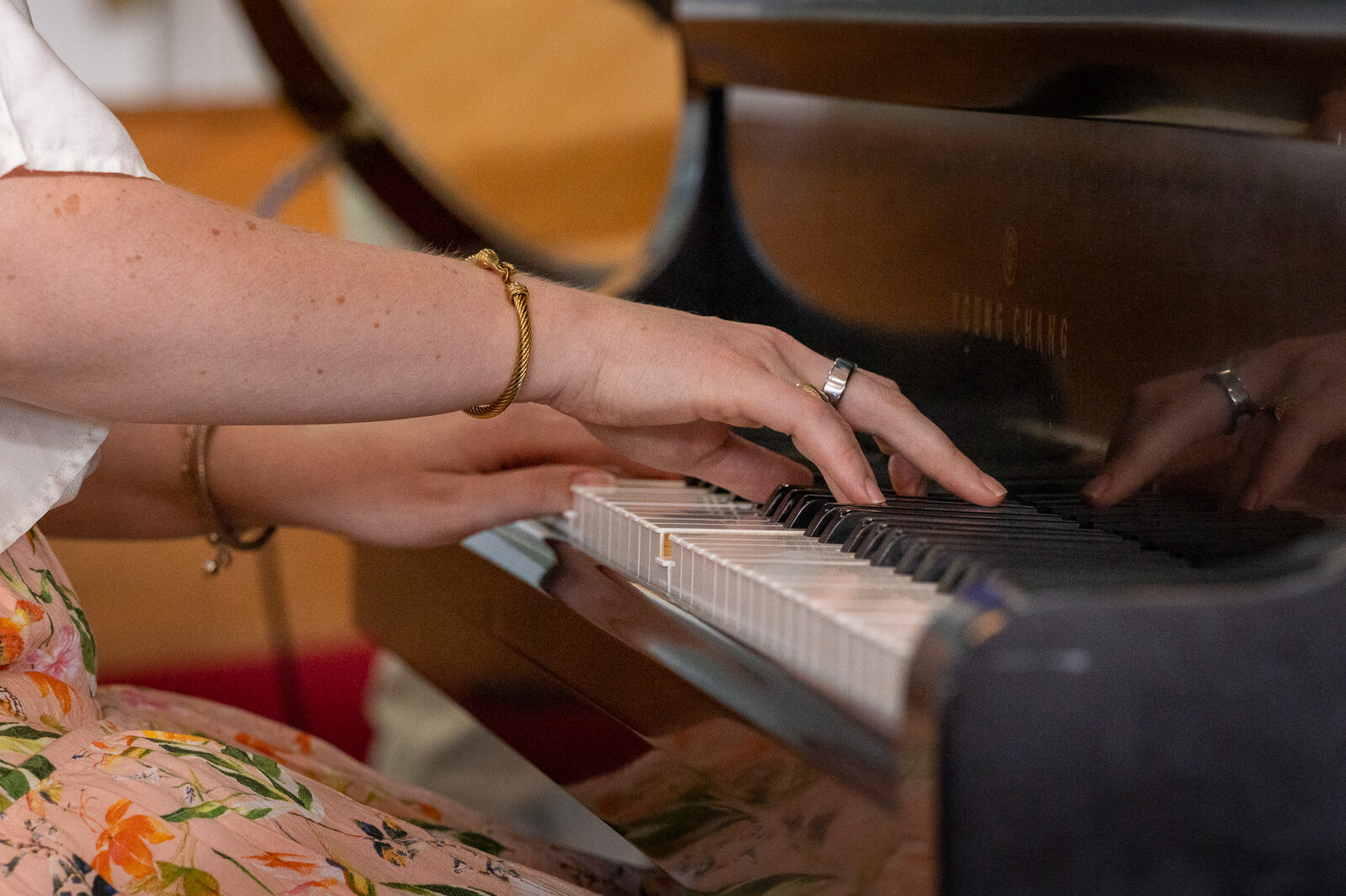 Hands at the piano keys